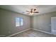 Bedroom with a ceiling fan, tile floors, large window with pretty lake views at 20427 W Mountain Sage Dr, Buckeye, AZ 85326
