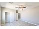 Bedroom featuring tile floors, a ceiling fan, and a closet at 20427 W Mountain Sage Dr, Buckeye, AZ 85326