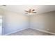 Neutral bedroom with a tile floor and modern ceiling fan at 20427 W Mountain Sage Dr, Buckeye, AZ 85326