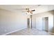 Bedroom featuring tile floors, a ceiling fan, and a closet at 20427 W Mountain Sage Dr, Buckeye, AZ 85326