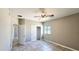 Bedroom featuring tile floors, a window, and a closet at 20427 W Mountain Sage Dr, Buckeye, AZ 85326