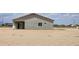 Exterior view of a new construction home featuring desert landscaping and stucco siding at 20427 W Mountain Sage Dr, Buckeye, AZ 85326
