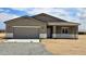 Charming single-story home with stucco, attached garage, and desert landscaping, ready for move-in at 20427 W Mountain Sage Dr, Buckeye, AZ 85326