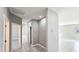 Hallway with tile floors leading to bedrooms and living areas at 20427 W Mountain Sage Dr, Buckeye, AZ 85326