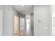 Hallway featuring tile flooring and neutral paint, connecting various rooms within the house at 20427 W Mountain Sage Dr, Buckeye, AZ 85326