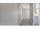 Long hallway with tile flooring leading into the house at 20427 W Mountain Sage Dr, Buckeye, AZ 85326