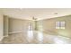 Spacious open-concept living room with tile flooring, neutral paint, and bright natural light at 20427 W Mountain Sage Dr, Buckeye, AZ 85326