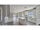 Open-concept living area with eat in kitchen, seamlessly flowing from kitchen to the living room at 20427 W Mountain Sage Dr, Buckeye, AZ 85326