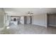 Open-concept living space seamlessly connects kitchen with center island to the living room, creating a modern layout at 20427 W Mountain Sage Dr, Buckeye, AZ 85326