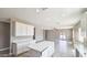 Spacious open floor plan kitchen area with white cabinets and quartz counters and an island at 20427 W Mountain Sage Dr, Buckeye, AZ 85326
