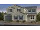 Charming two-story home featuring a stone-accented facade, gray siding, and complementary shutters at 20486 E Via Del Jardin --, Queen Creek, AZ 85142