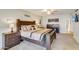 Spacious bedroom with a large bed, matching nightstands and dressers, and a ceiling fan at 2328 W Nopal Ave, Mesa, AZ 85202