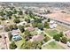 An overhead view of a residential neighborhood with tree-lined streets, lush greenery, and well-maintained properties at 2331 E Melrose St, Gilbert, AZ 85297