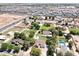 Expansive aerial view of the community with lush greenery, multiple swimming pools, and beautiful homes at 2331 E Melrose St, Gilbert, AZ 85297