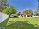 Expansive backyard featuring lush green grass, mature trees, and a privacy fence at 2331 E Melrose St, Gilbert, AZ 85297
