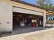 Spacious garage interior with an open door and lots of space for vehicles or projects at 2331 E Melrose St, Gilbert, AZ 85297