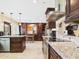 Gourmet kitchen boasting custom cabinets, granite countertops, and modern stainless steel appliances at 2331 E Melrose St, Gilbert, AZ 85297