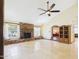Bright living room featuring a brick fireplace, neutral furniture, and an open layout at 2331 E Melrose St, Gilbert, AZ 85297