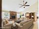 Bright living room featuring a brick fireplace, neutral furniture, and an open layout at 2331 E Melrose St, Gilbert, AZ 85297