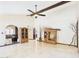 Open-concept living space with travertine flooring, wooden cabinets, and an inviting atmosphere at 2331 E Melrose St, Gilbert, AZ 85297