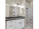 Bathroom features a vanity with a large mirror and a glass enclosed shower at 23408 W Barwick Dr, Wittmann, AZ 85361
