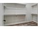 Spacious walk-in closet with built-in shelving for optimal organization at 23408 W Barwick Dr, Wittmann, AZ 85361