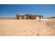 Single-story home with a three-car garage and ample front yard space at 23408 W Barwick Dr, Wittmann, AZ 85361