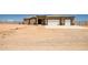 Single Gathering home featuring a two car garage and desert landscaping at 23408 W Barwick Dr, Wittmann, AZ 85361