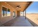 Spacious covered patio with views of the open backyard at 23408 W Barwick Dr, Wittmann, AZ 85361