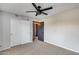 Bedroom with carpet, closet, ceiling fan, and grey walls at 23420 N 121St Ave, Sun City, AZ 85373