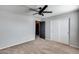 Bedroom with neutral walls, carpet, ceiling fan and closet at 23420 N 121St Ave, Sun City, AZ 85373