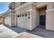 Charming home entrance featuring a two-car garage, brick walkway and convenient keyless entry at 23420 N 121St Ave, Sun City, AZ 85373
