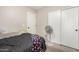 The cozy bedroom includes a ceiling fan and neutral walls at 24009 W Antelope Trl, Buckeye, AZ 85326