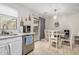 Charming dining area features tile floors, updated lighting, and easy access to the kitchen at 24009 W Antelope Trl, Buckeye, AZ 85326