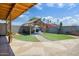 Backyard with artificial turf, patio and outdoor grill at 2727 W Libby St, Phoenix, AZ 85053