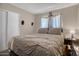 Cozy bedroom features a comfortable bed, soft lighting, and ample storage for a serene retreat at 2727 W Libby St, Phoenix, AZ 85053