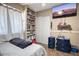 Bedroom with a TV, large closet and shelving for storage and display at 2727 W Libby St, Phoenix, AZ 85053