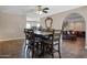 Open dining area features a stylish table adjacent to a cozy living room, promoting seamless entertaining at 2727 W Libby St, Phoenix, AZ 85053