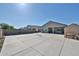 Spacious backyard features a concrete patio, shed, and ample space for outdoor activities at 30935 W Mulberry Dr, Buckeye, AZ 85396