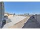 Wide backyard features a concrete patio, shed, and ample space for outdoor activities at 30935 W Mulberry Dr, Buckeye, AZ 85396