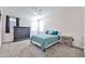 Bedroom with carpet and ceiling fan, featuring an area rug and a dresser at 30935 W Mulberry Dr, Buckeye, AZ 85396