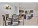 Open concept dining area connected to the kitchen, featuring a dark wood table with seating for six at 30935 W Mulberry Dr, Buckeye, AZ 85396