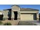 Charming single-story home with a two-car garage and well-maintained front yard at 30935 W Mulberry Dr, Buckeye, AZ 85396