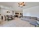 Spacious living room with tile flooring, open layout, and combined dining and kitchen areas at 30935 W Mulberry Dr, Buckeye, AZ 85396