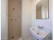 Bright bathroom featuring a tiled shower with a standard sink and a mirrored vanity at 3317 N 10Th Ave, Phoenix, AZ 85013