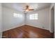 Bedroom with wood floors, bright windows, and ceiling fan at 3317 N 10Th Ave, Phoenix, AZ 85013