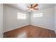 Bedroom with hardwood floors, bright windows, and ceiling fan at 3317 N 10Th Ave, Phoenix, AZ 85013
