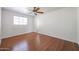 Comfortable bedroom with hardwood floors, ceiling fan, and natural light at 3317 N 10Th Ave, Phoenix, AZ 85013