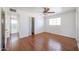 Bright bedroom with hardwood floors, ceiling fan, and bathroom access at 3317 N 10Th Ave, Phoenix, AZ 85013