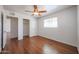 Bedroom with wood floors, bright windows, a closet, and a ceiling fan at 3317 N 10Th Ave, Phoenix, AZ 85013